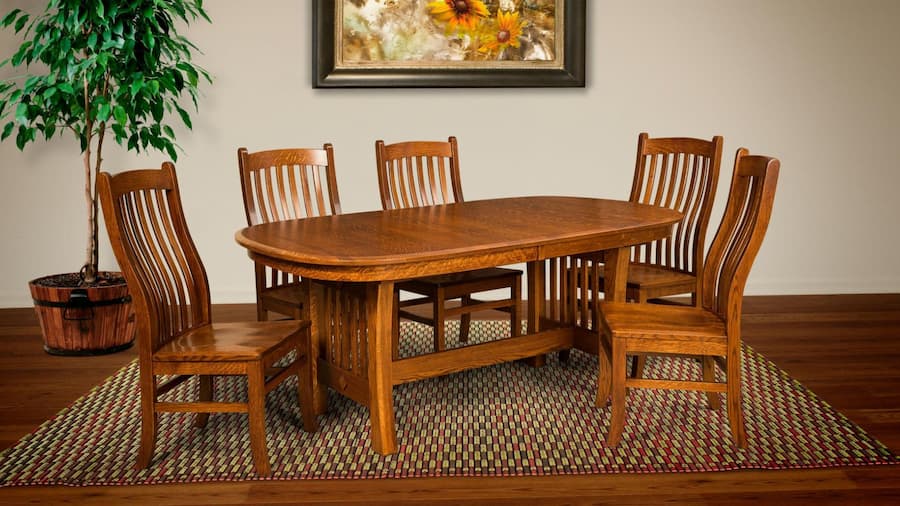 Image of a wooden dining furniture with a table and chairs with plants in back