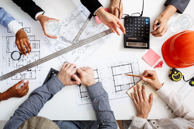 businessmen-hands-white-table-with-documents-drafts-1